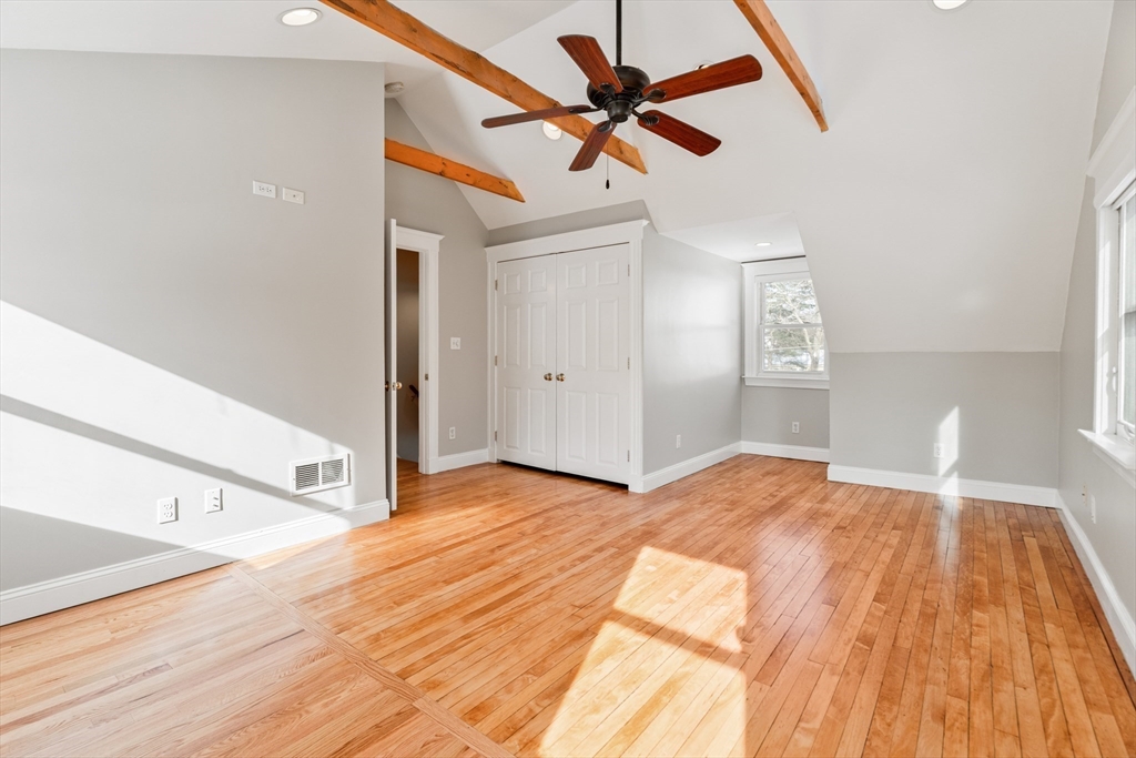 9 Pearl Street Walpole, MA 02081 - Photo 18 of 22 a view of a livingroom with wooden floor and a ceiling fan