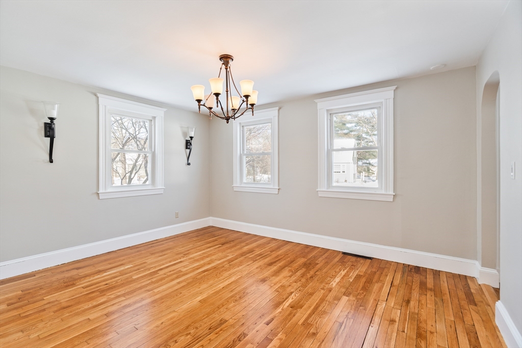 9 Pearl Street Walpole, MA 02081 - Photo 8 of 22 a view of empty room with wooden floor and fan