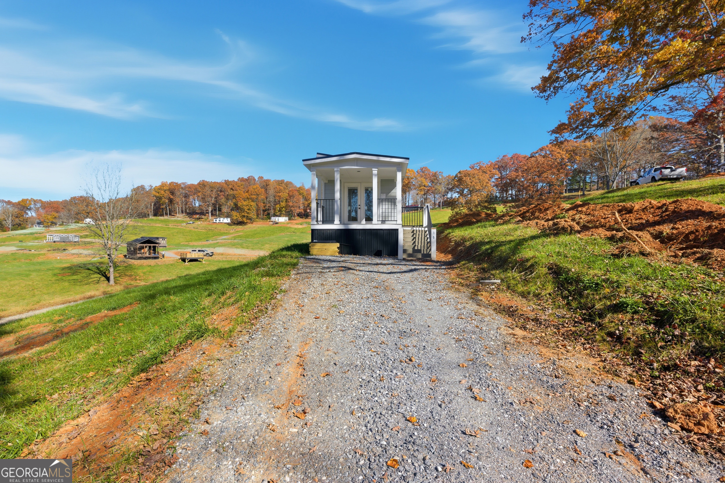 527 Saunders Road Franklin, NC 28734 - Photo 1 of 16 a front view of a house with a yard