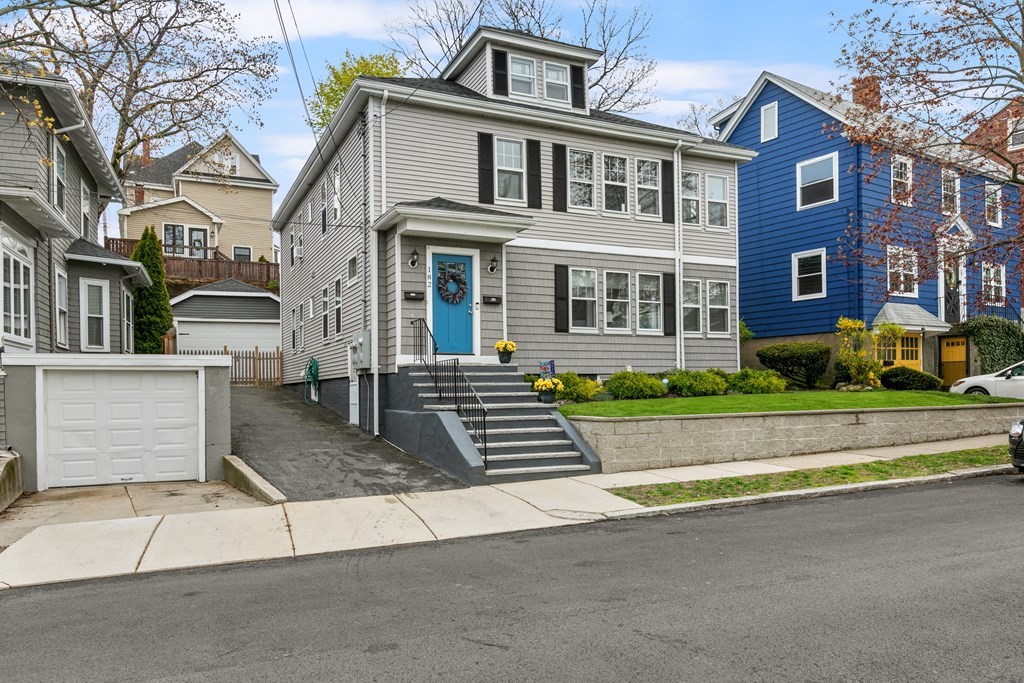 182 Court Road, Unit 1 Winthrop, MA 02152 - Photo 1 of 16 a front view of a house with a garden and plants