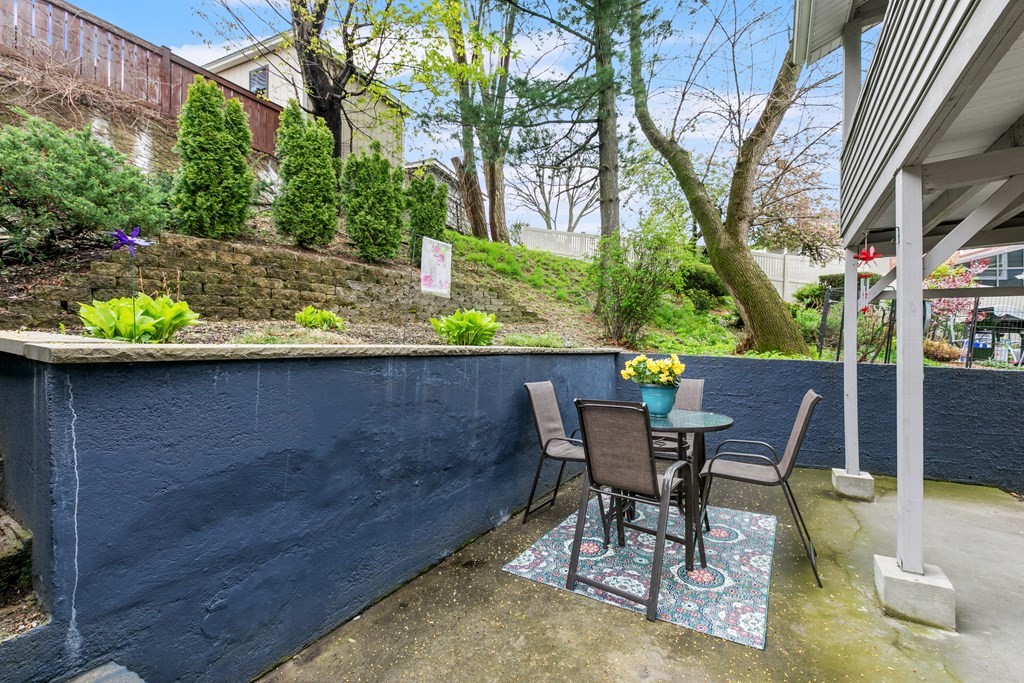 182 Court Road, Unit 1 Winthrop, MA 02152 - Photo 14 of 16 a view of a chairs and table in the patio