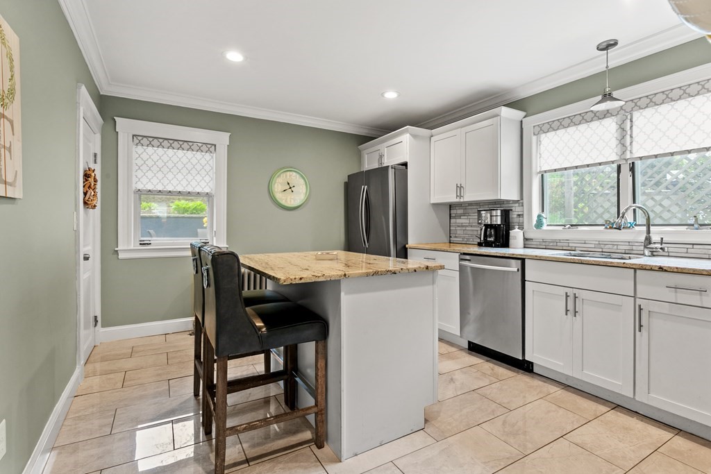 182 Court Road, Unit 1 Winthrop, MA 02152 - Photo 2 of 16 a kitchen with a sink a window and appliances