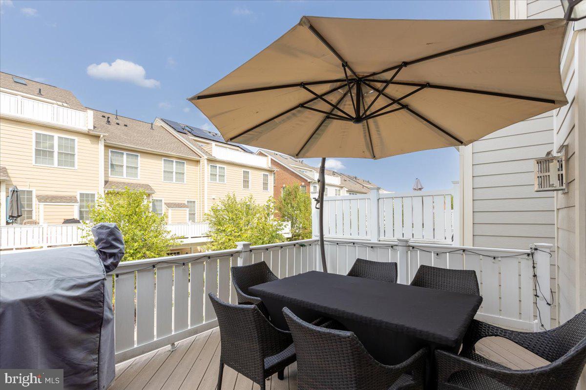 2617 Maple Rock Road Hanover, MD 21076 - Photo 24 of 53 a backyard of a house with a table and chairs