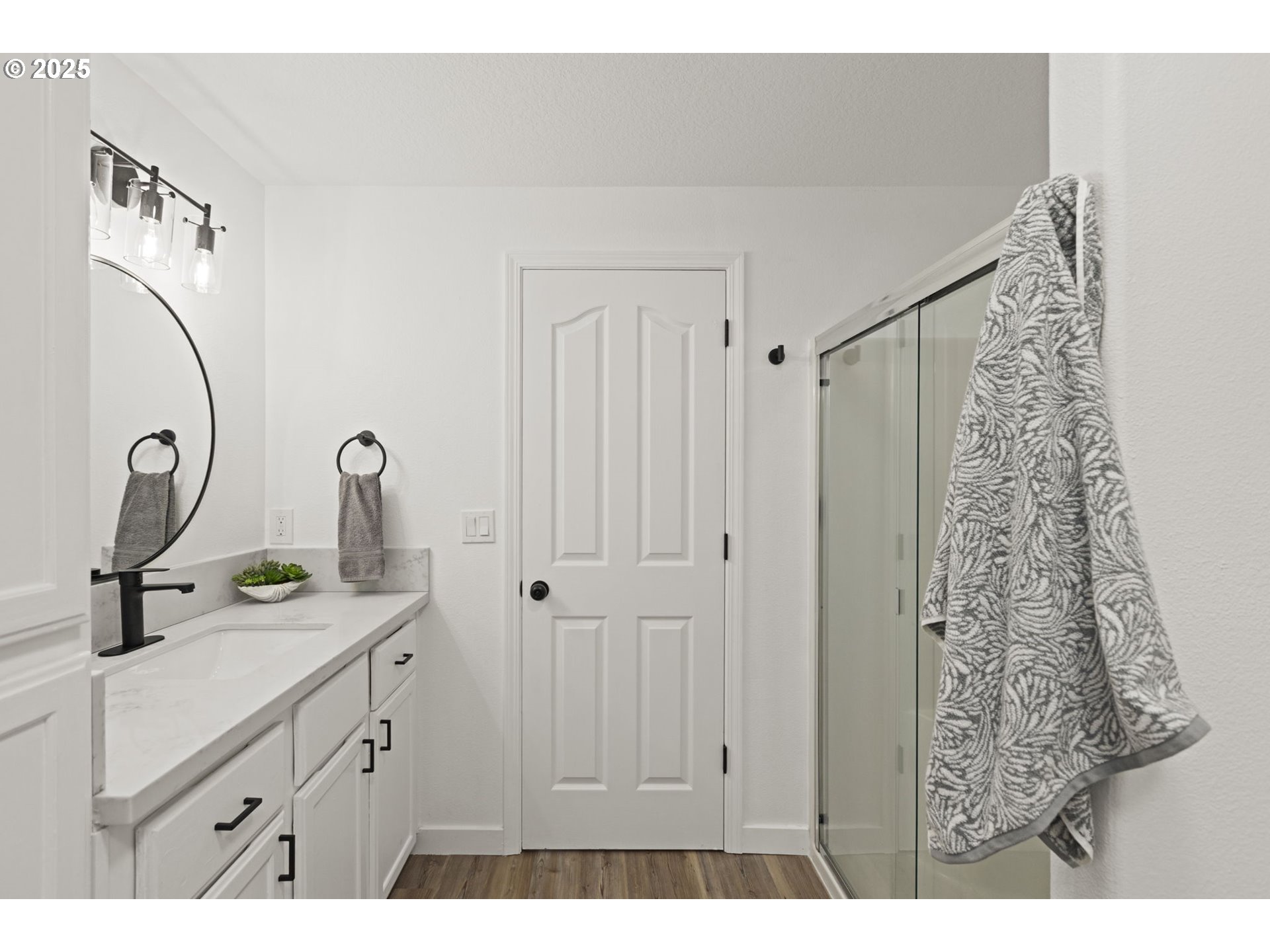 9980 Pine Ridge Drive Nehalem, OR 97131 - Photo 15 of 27 a bathroom with a sink and mirror