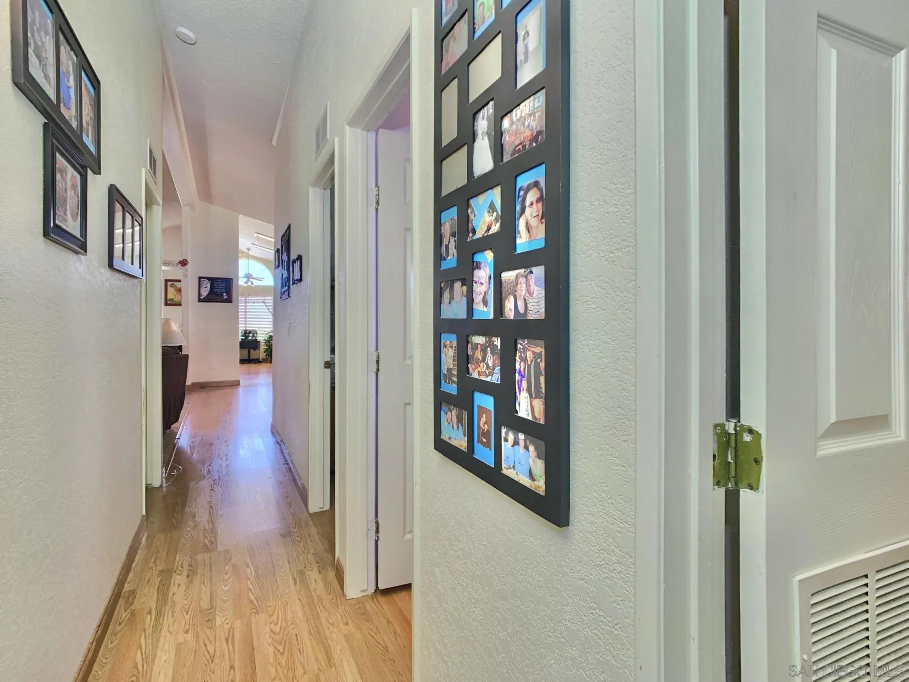 2541 Columbine Road Alpine, CA 91901 - Photo 19 of 44 a view of a hallway with wooden floor and dining room