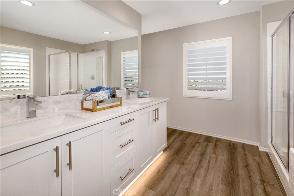 9075 Carson Avenue Hesperia, CA 92344 - Photo 8 of 13 a bathroom with a sink double vanity and a window