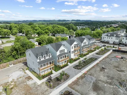 an aerial view of residential house with outdoor space
