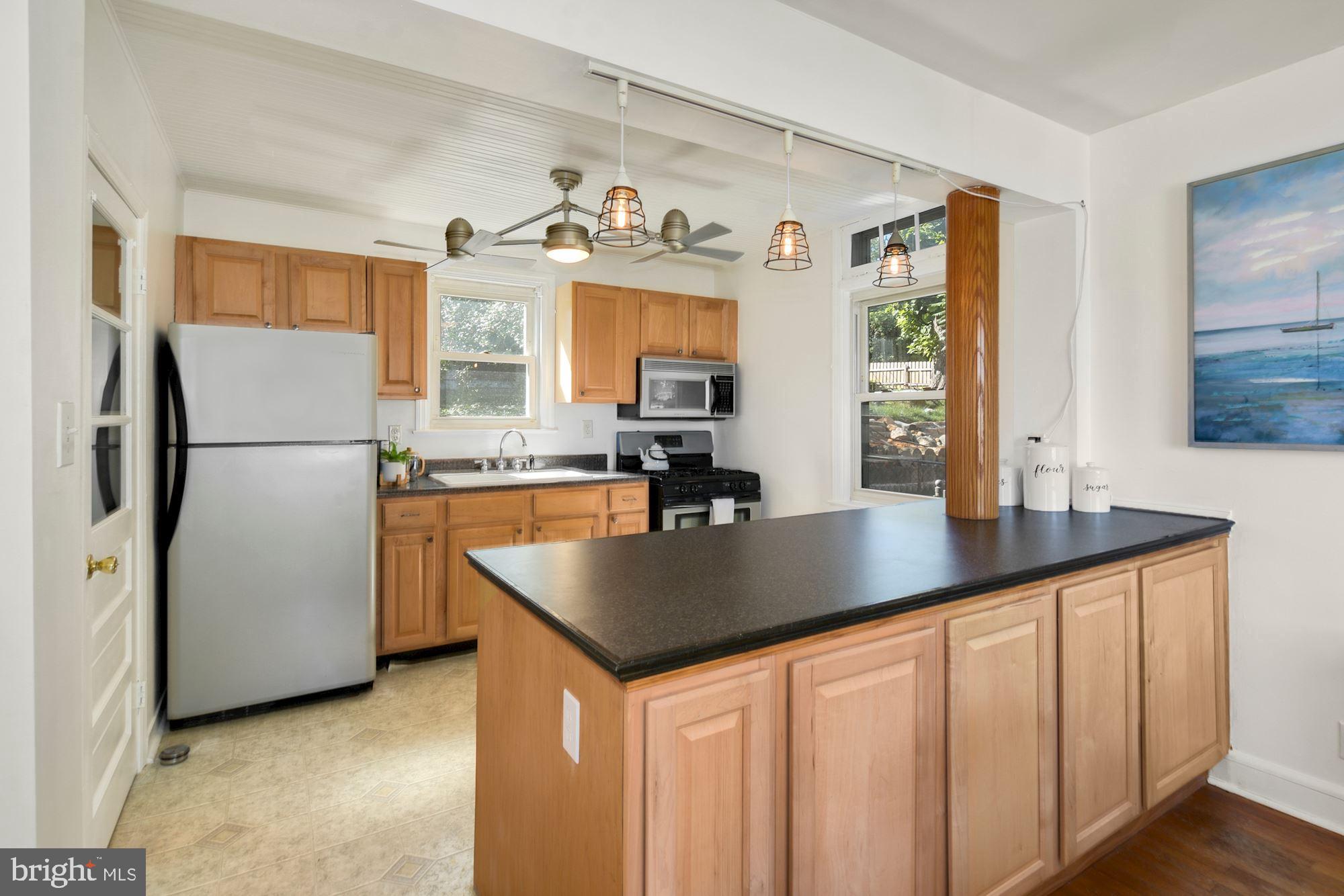 706 Devonshire Road Baltimore, MD 21229 - Photo 11 of 32 Large kitchen peninsula with storage on both sides