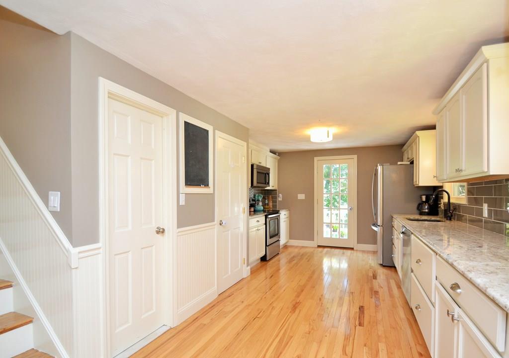14 Sylvan Road Holbrook, MA 02343 - Photo 5 of 28 a large kitchen with a lot of counter space and wooden floor