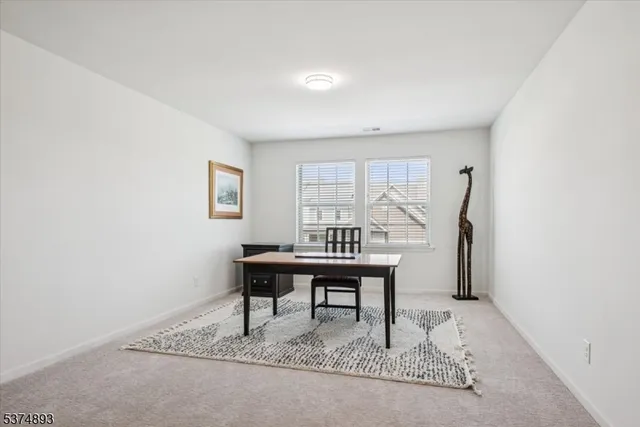 a view of a workspace with furniture