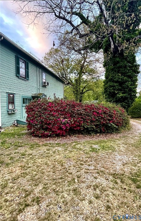 12133 Winfree Street Chester, VA 23831 - Photo 1 of 1 a front view of a house with a garden