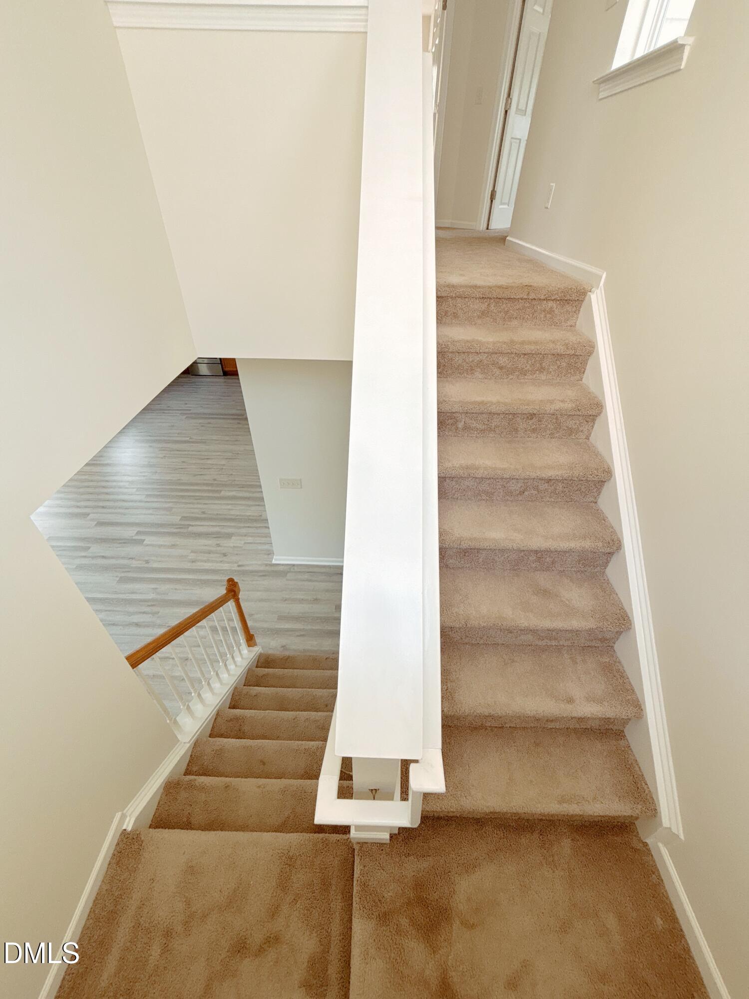 112 Ryder Cup Circle Raleigh, NC 27603 - Photo 14 of 45 a view of staircase with white walls