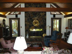 237 Baynes Road Waynesboro, VA 22980 - Photo 3 of 12 a living room with furniture a lamp and rug