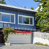 a front view of a house with a garage