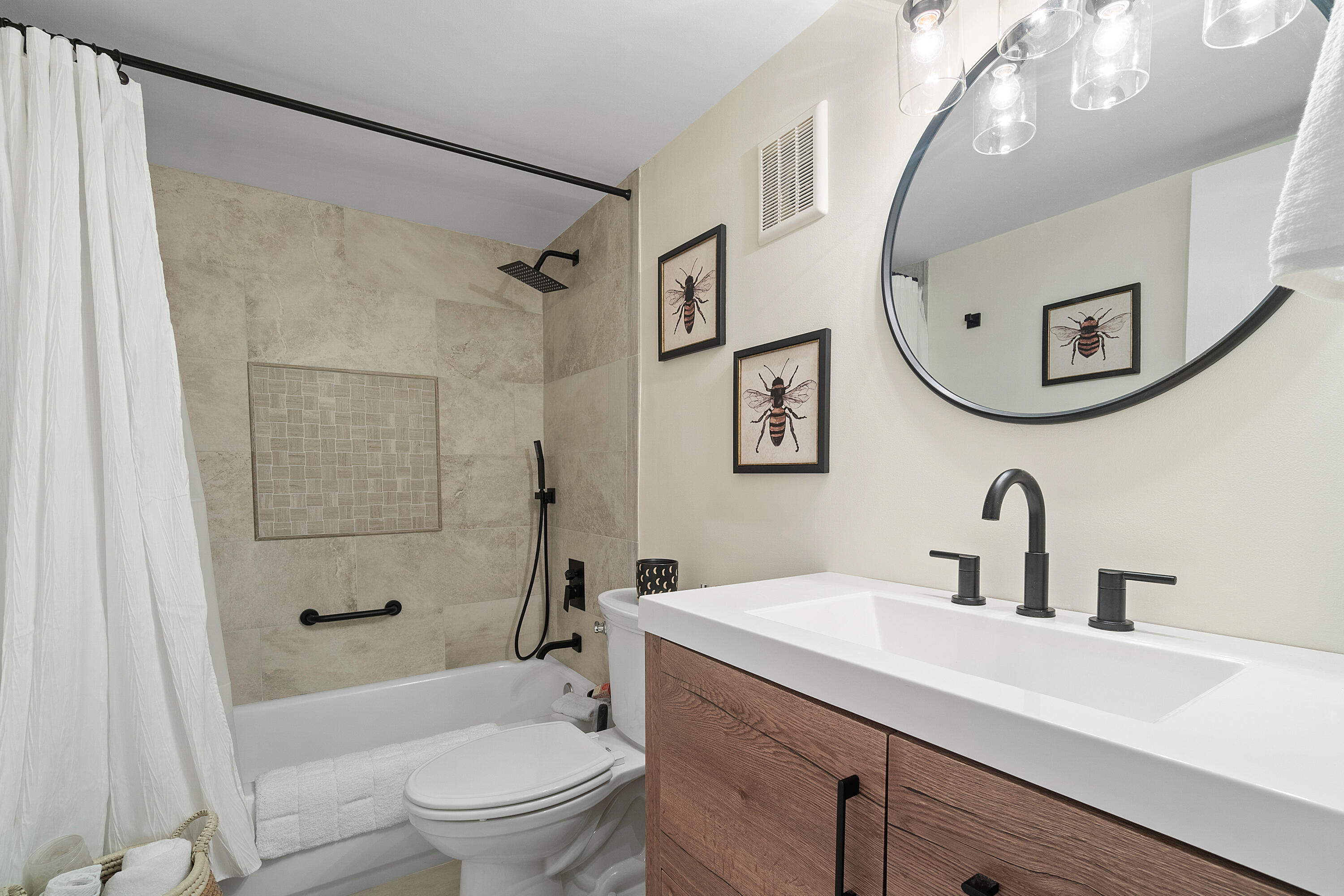 755 Dotterel Road, Unit 1312 Delray Beach, FL 33444 - Photo 13 of 21 a bathroom with a sink a mirror a toilet and a shower