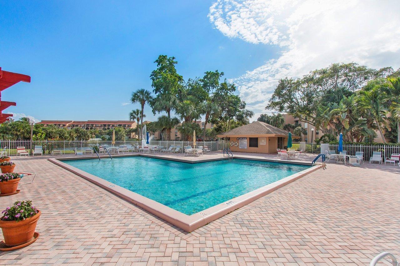 755 Dotterel Road, Unit 1312 Delray Beach, FL 33444 - Photo 19 of 21 a view of a swimming pool with a patio
