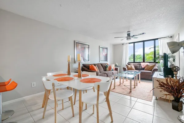 a view of a dining room with furniture and window
