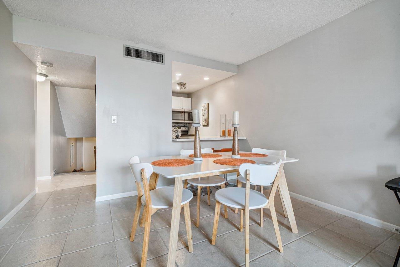 755 Dotterel Road, Unit 1312 Delray Beach, FL 33444 - Photo 6 of 21 a view of a dining room with furniture