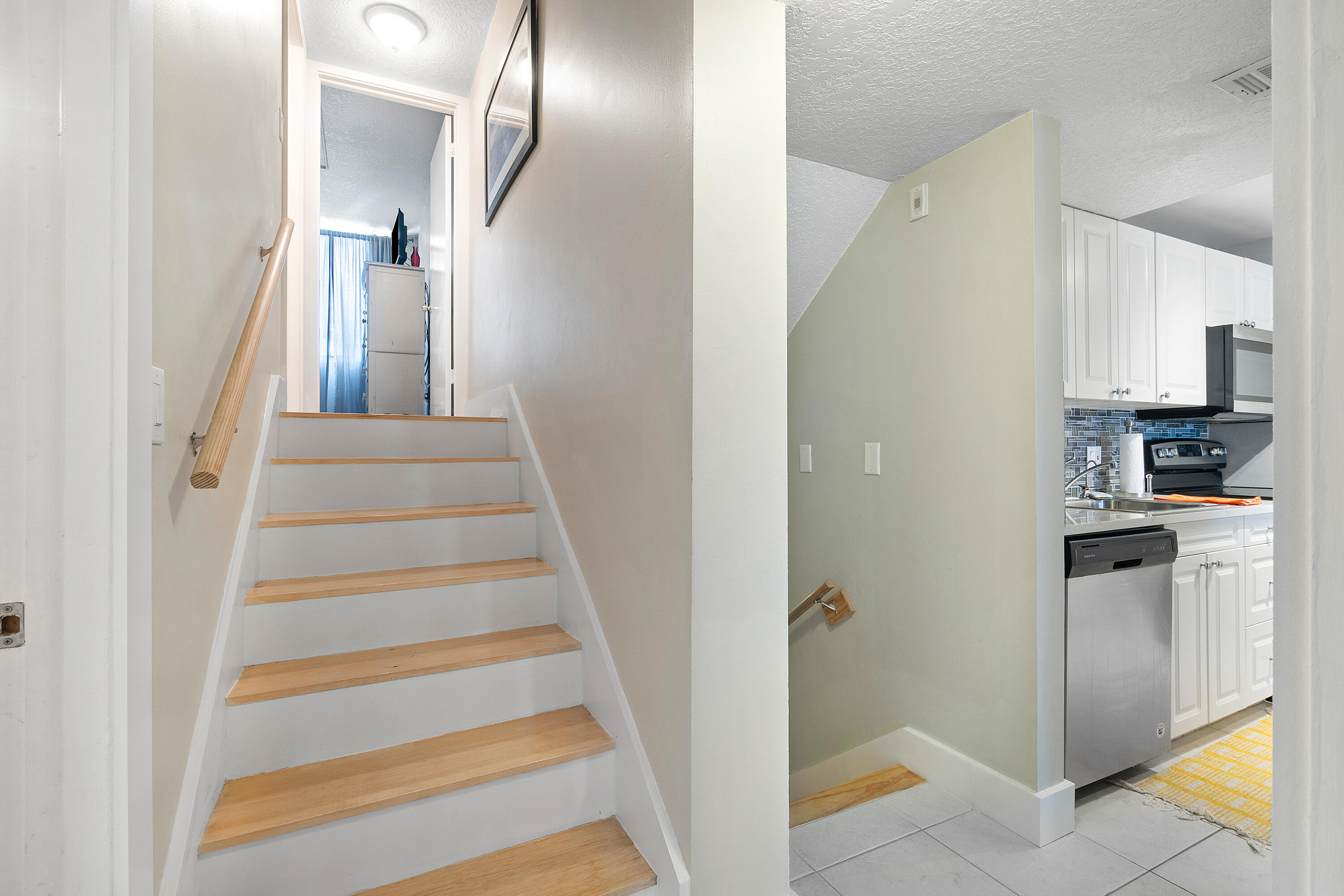 755 Dotterel Road, Unit 1312 Delray Beach, FL 33444 - Photo 7 of 21 a view of entryway and hall with wooden floor
