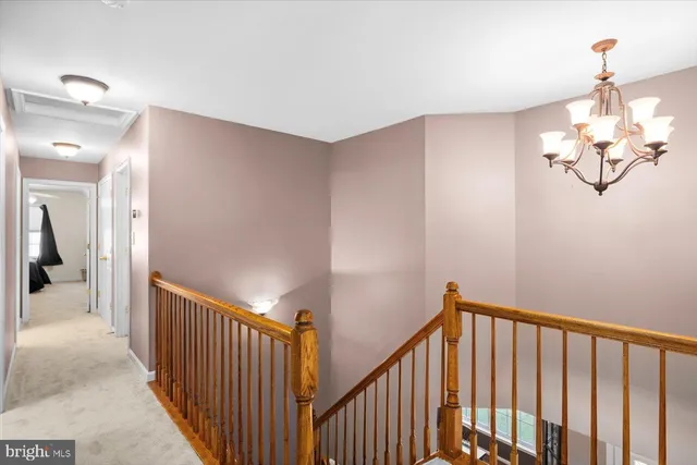 a bedroom with a bed a window and dresser