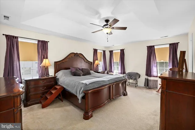 a bedroom with a bed and a chair