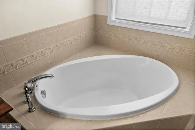 a bathroom with a sink vanity mirror and toilet