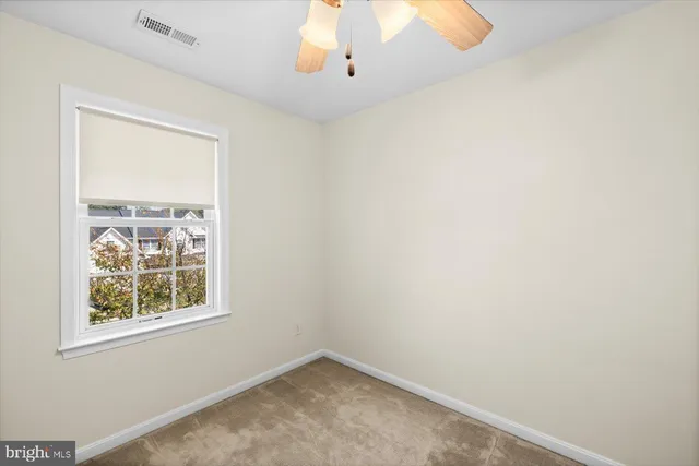 a living room with a flat screen tv and washer