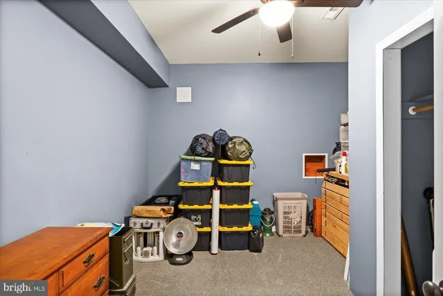 a view of a house with swimming pool and sitting area