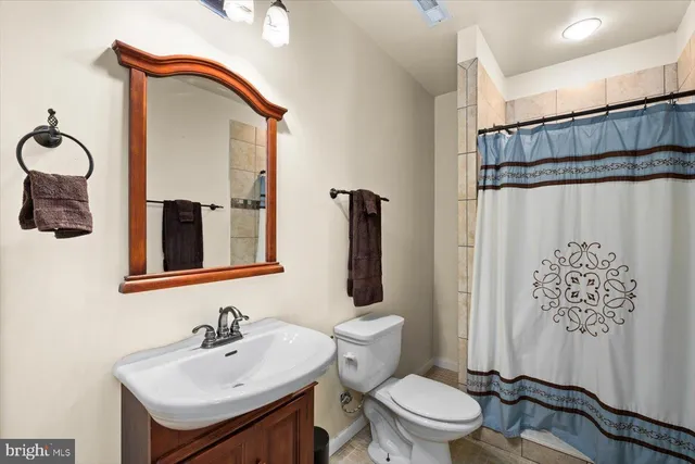 a view of a house with swimming pool and sitting area