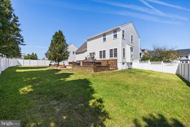 a view of a backyard with sitting area