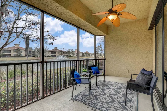 a view of a chairs and table in the balcony