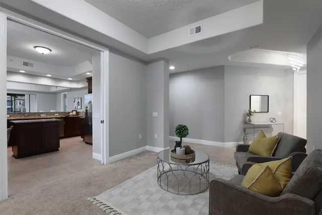 a dining room with furniture and chandelier