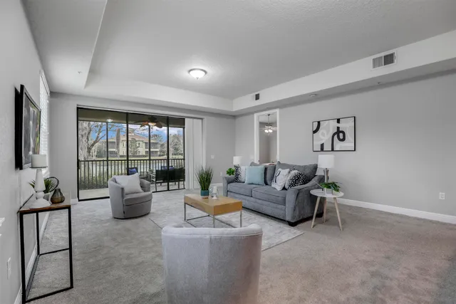 a living room with furniture or couch and a flat screen tv