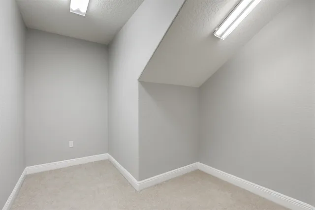 a view of a lake with boats and trees in the background