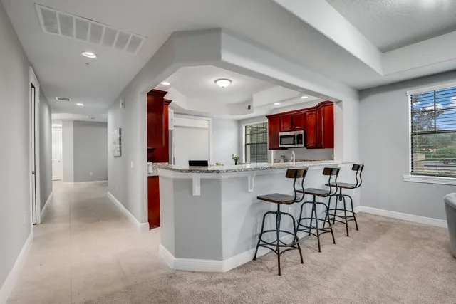 a view of kitchen with furniture and wooden floor