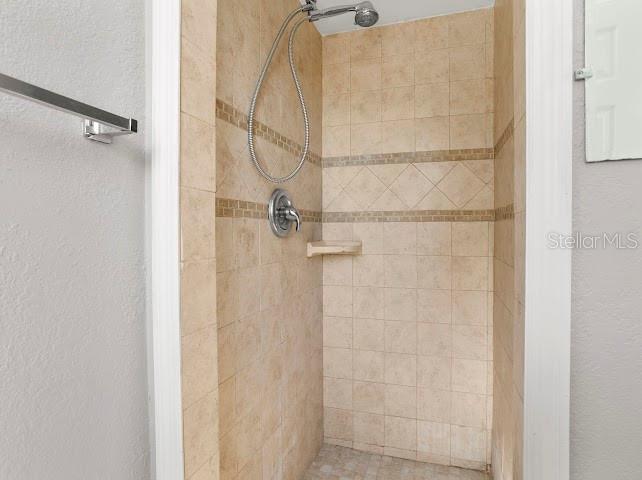 5614 Riviera Drive Orlando, FL 32808 - Photo 12 of 15 a bathroom with a shower