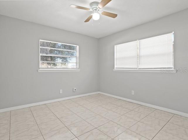5614 Riviera Drive Orlando, FL 32808 - Photo 13 of 15 a view of an empty room with a window