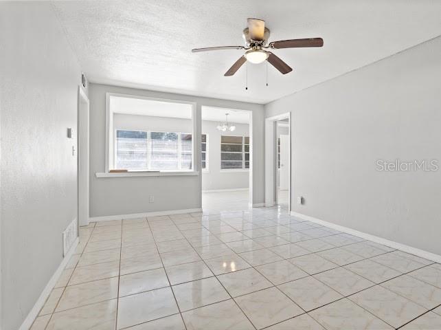 5614 Riviera Drive Orlando, FL 32808 - Photo 5 of 15 a view of an empty room with a window