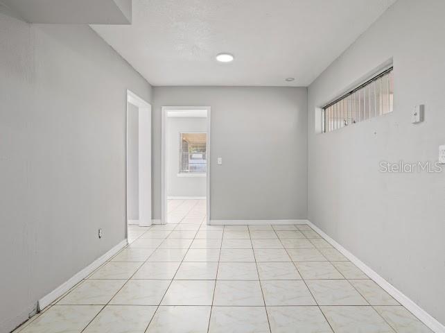 5614 Riviera Drive Orlando, FL 32808 - Photo 7 of 15 a view of an empty room and window
