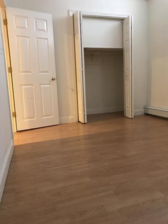 21 Aberdeen Street, Unit A Boston, MA 02215 - Photo 2 of 6 an empty room with closet area