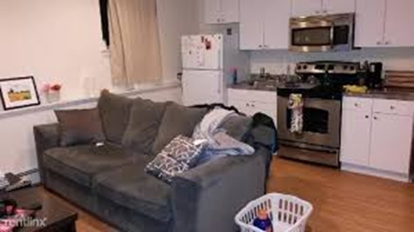 21 Aberdeen Street, Unit A Boston, MA 02215 - Photo 6 of 6 a living room with furniture and a fireplace