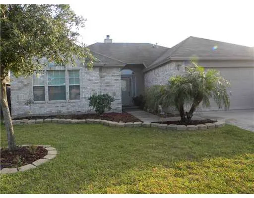 a view of a house with a garden