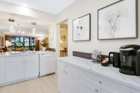 a bathroom with a sink mirror and vanity