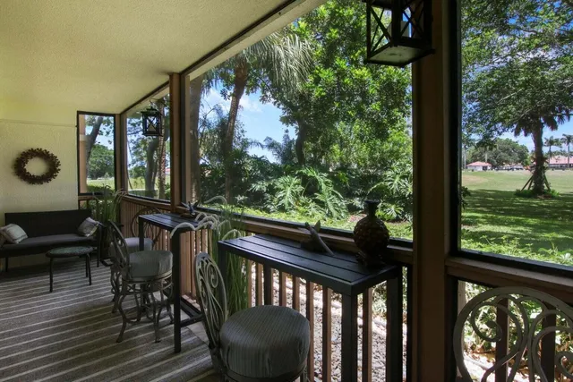 a view of a two chairs in the balcony