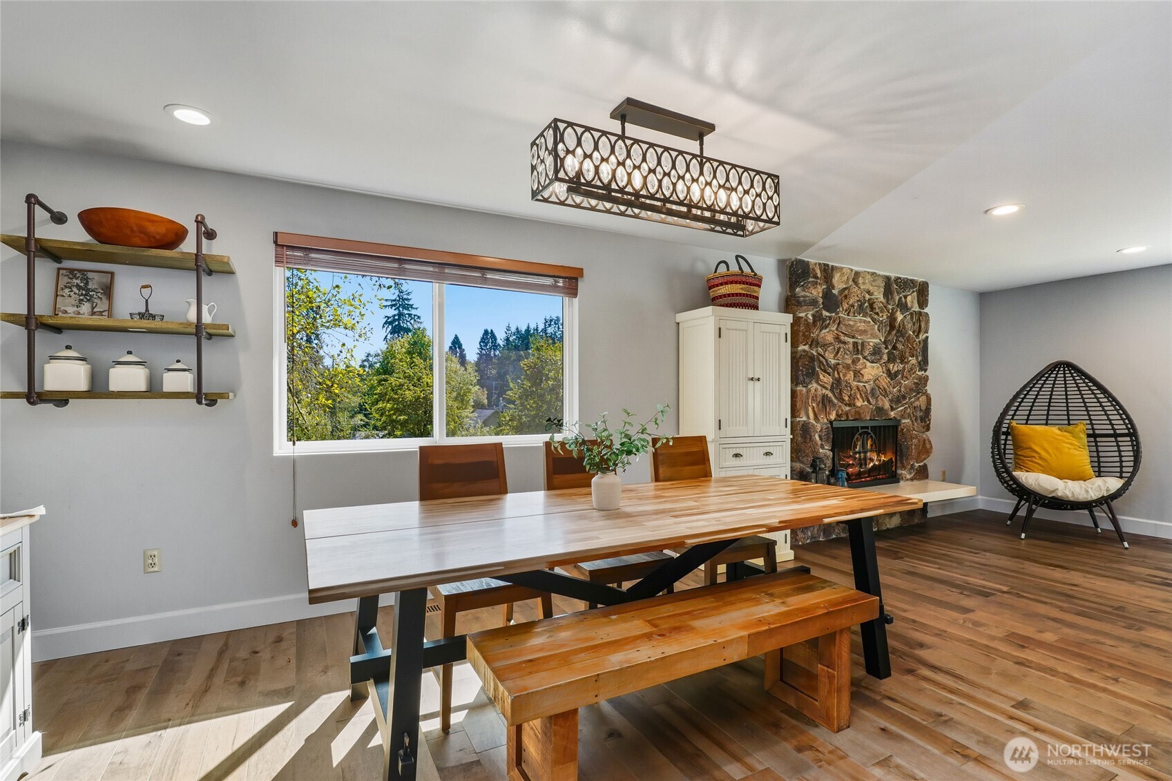 10414 Southwest 110th Street Vashon, WA 98070 - Photo 15 of 37 a view of a dining room with furniture and wooden floor