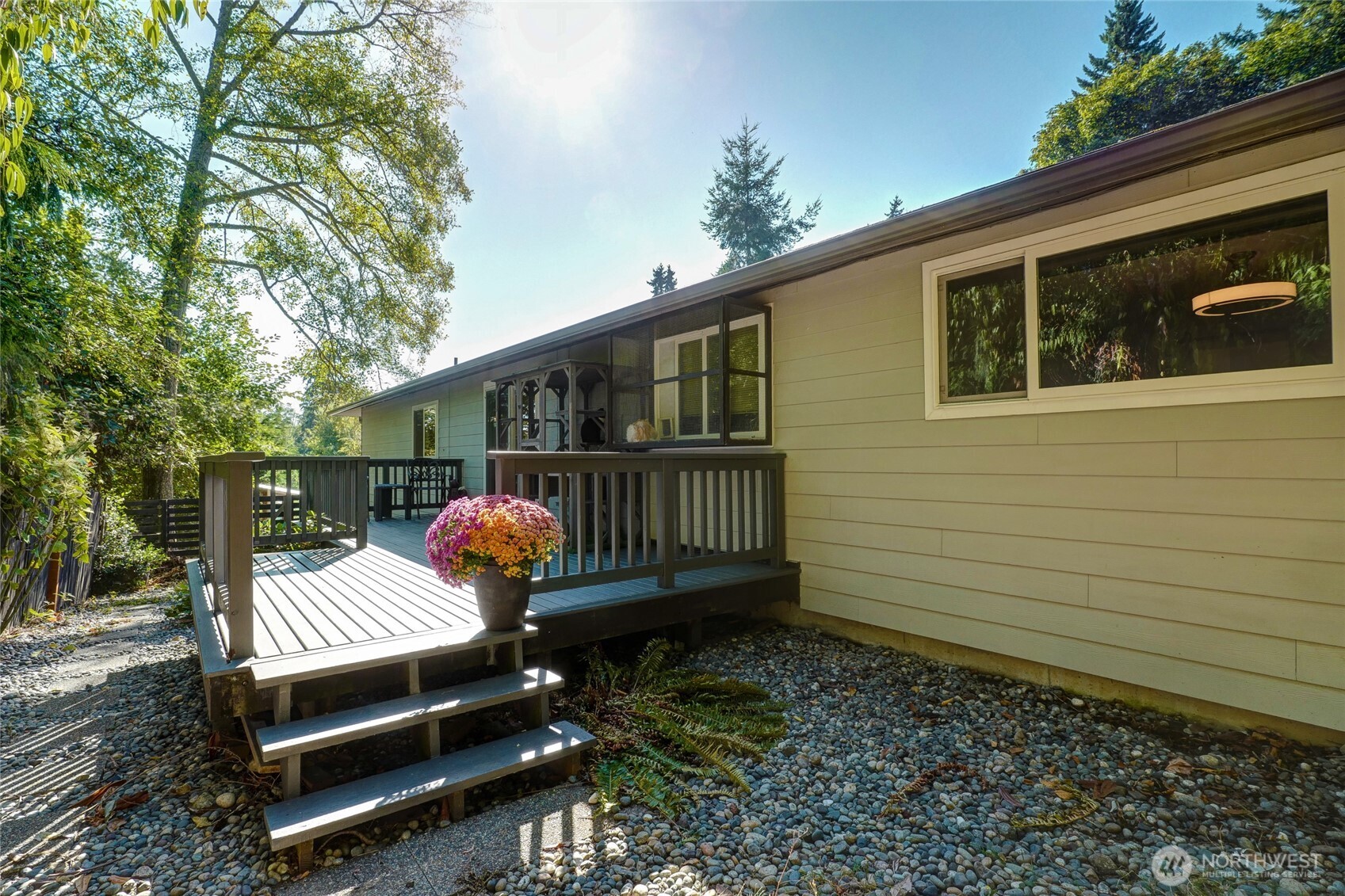 10414 Southwest 110th Street Vashon, WA 98070 - Photo 25 of 37 a front view of a house with garden