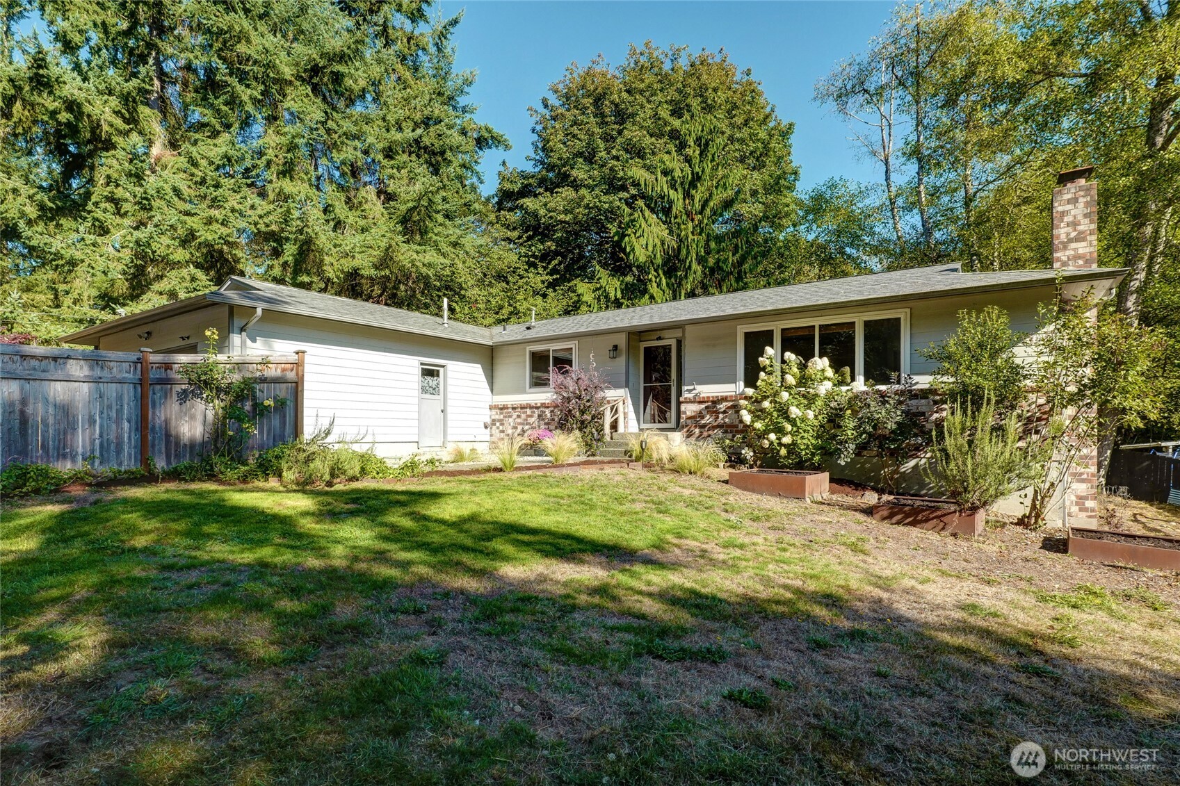 10414 Southwest 110th Street Vashon, WA 98070 - Photo 26 of 37 a front view of house with yard and green space