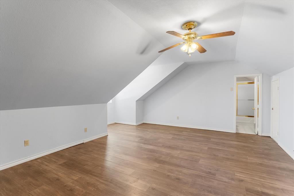 410 Etheridge Road Canton, TX 75103 - Photo 18 of 22 4th bedroom or Bonus room with ceiling fan, lofted ceiling, wood finished floors, and baseboards and en suite bath