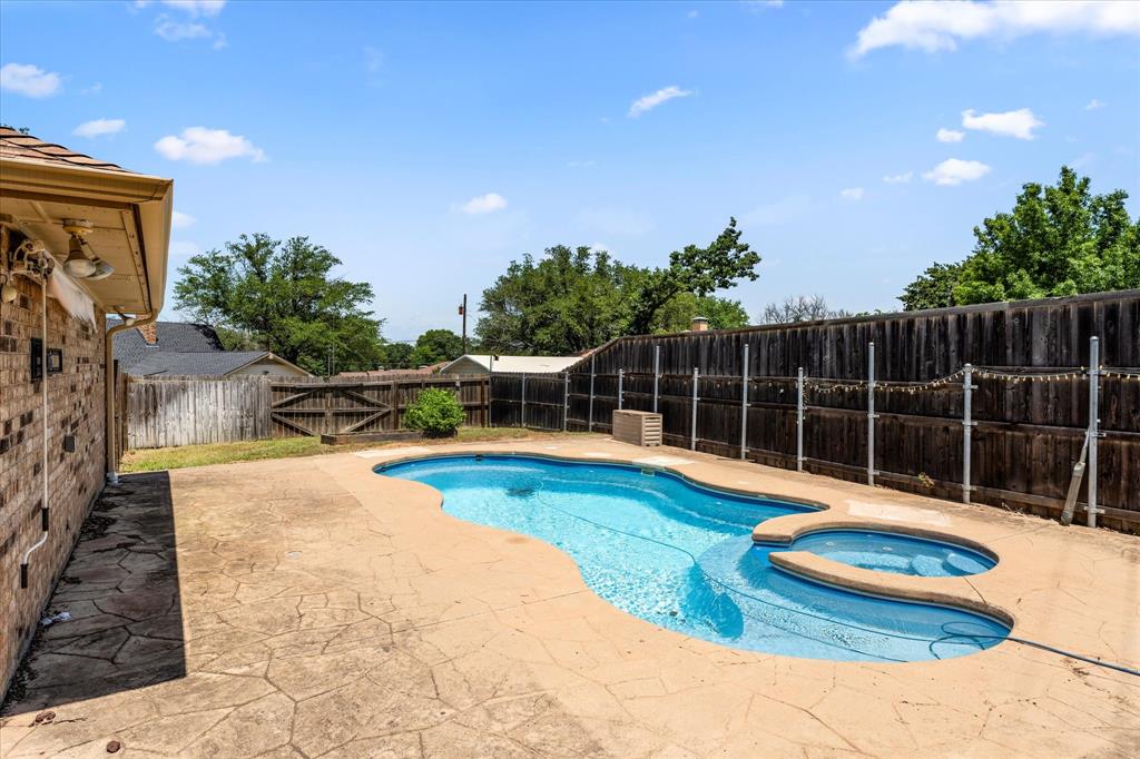 410 Etheridge Road Canton, TX 75103 - Photo 2 of 22 View of swimming pool featuring a patio area, a fenced backyard, and a pool with connected hot tub