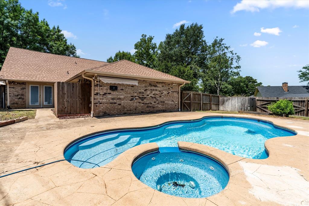 410 Etheridge Road Canton, TX 75103 - Photo 5 of 22 View of swimming pool with french doors, a patio, a fenced backyard, and a pool with connected hot tub